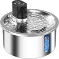Stainless steel pet water fountain with a white constant temperature heating base on a wooden floor.