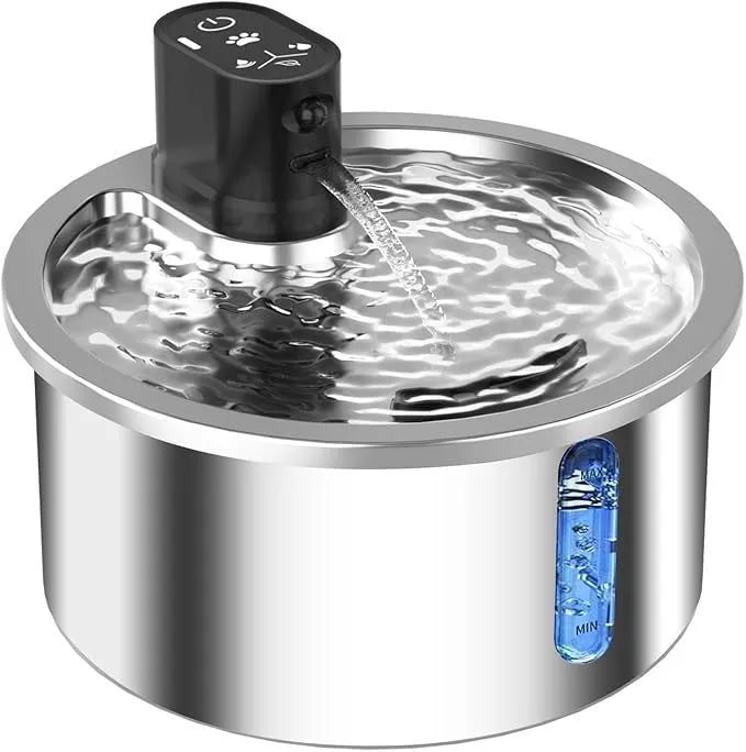 Stainless steel pet water fountain with a white constant temperature heating base on a wooden floor.