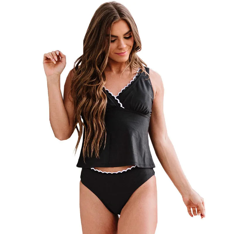 Black solid colour sleeveless women's nylon bikini swimsuit set laid flat.