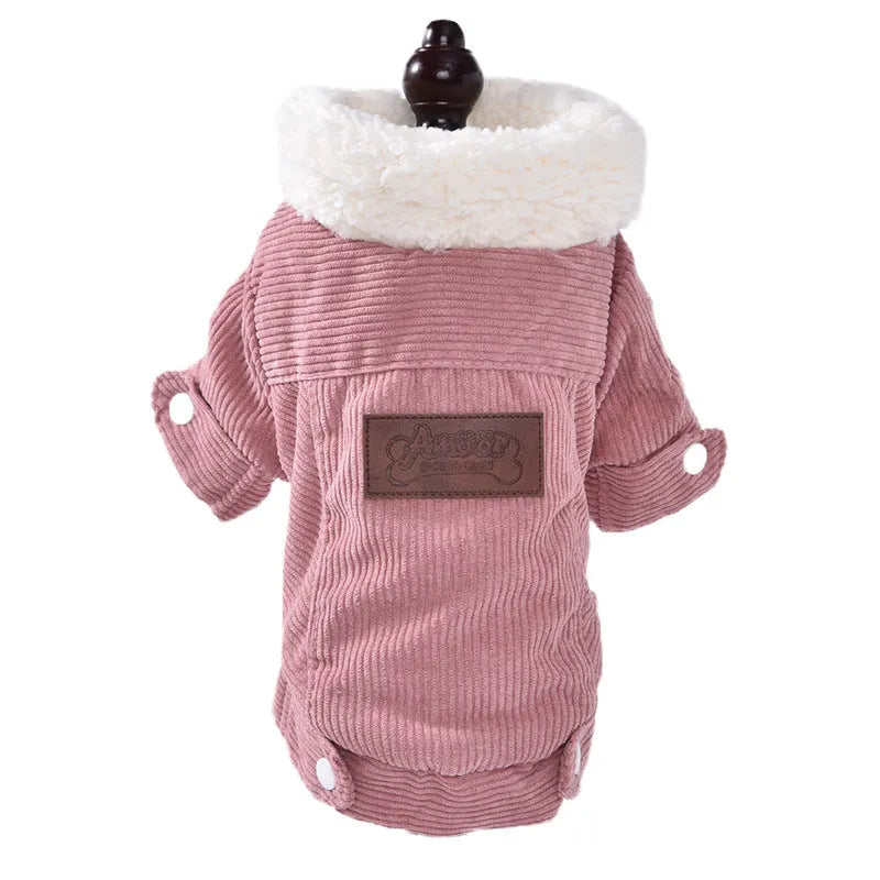 A grey lambswool-lined padded vest for dogs, shown on a mannequin, for winter warmth.