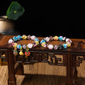 Handmade glass bracelet with swallowing gold beast charm and heart-shaped fluorescent glaze beads