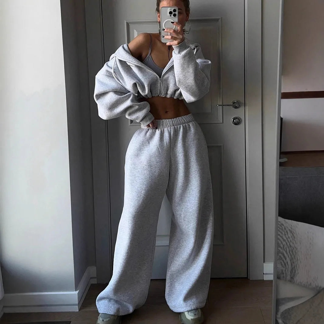 Men's grey long sleeve polyester tracksuit set with coat and trousers laid flat.