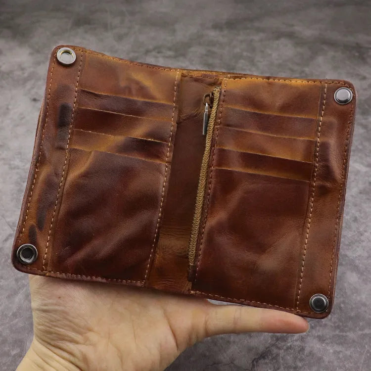 Men's retro-style long cowhide leather wallet open to show card slots, coin pocket, and bill compartment.
