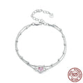 Silver heart-shaped charm bracelet for women on an adjustable chain.