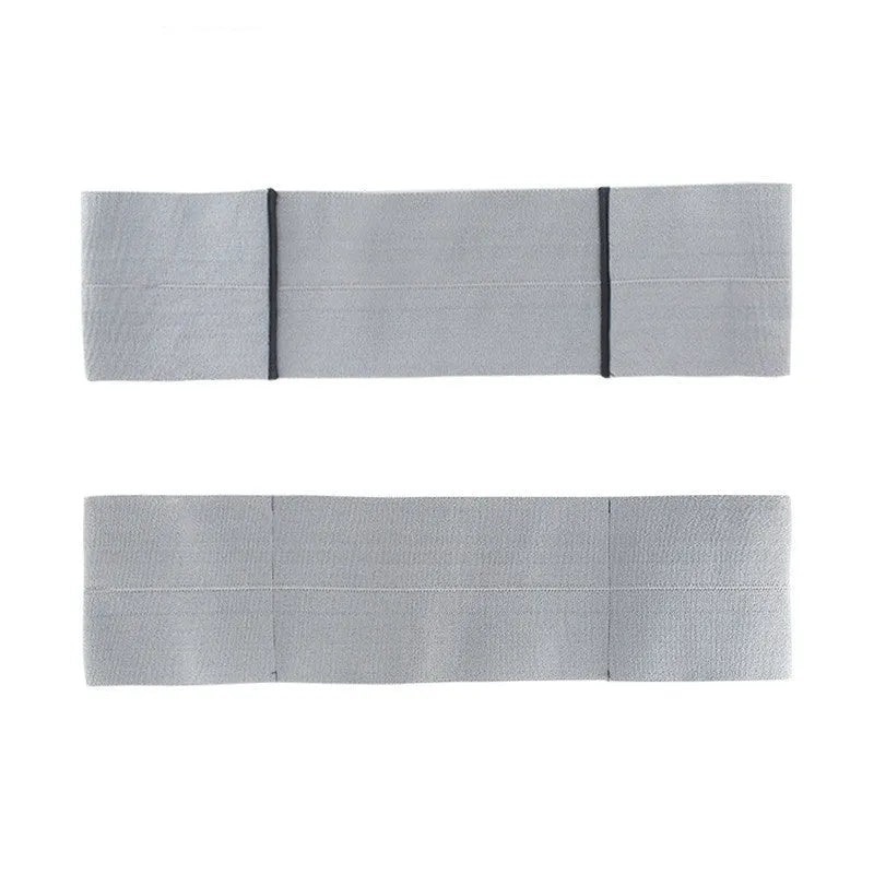 A black elastic elbow support bandage or compression sleeve worn on an arm.