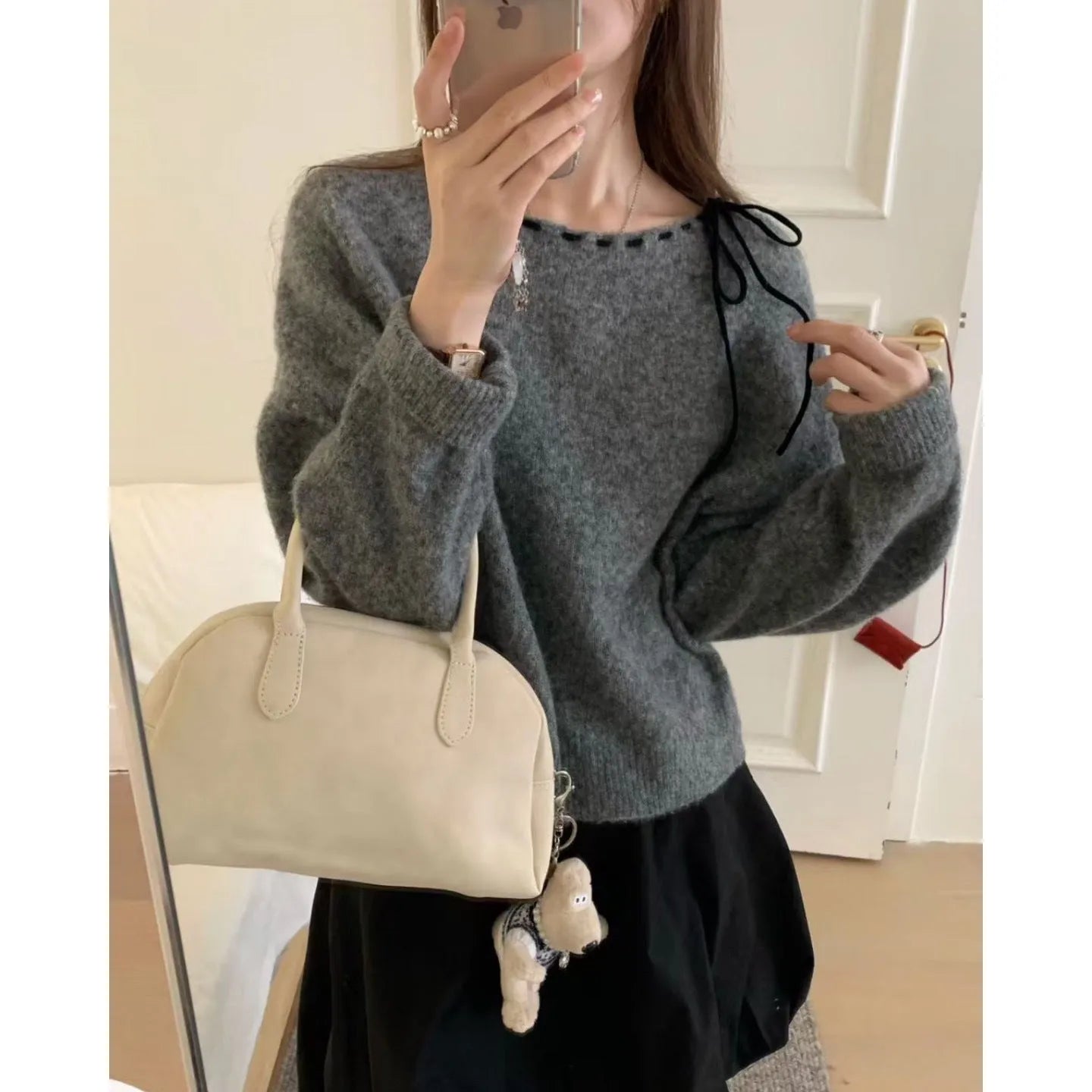 Grey loose-fitting women's pullover jumper made from regenerated cellulose fibre.
