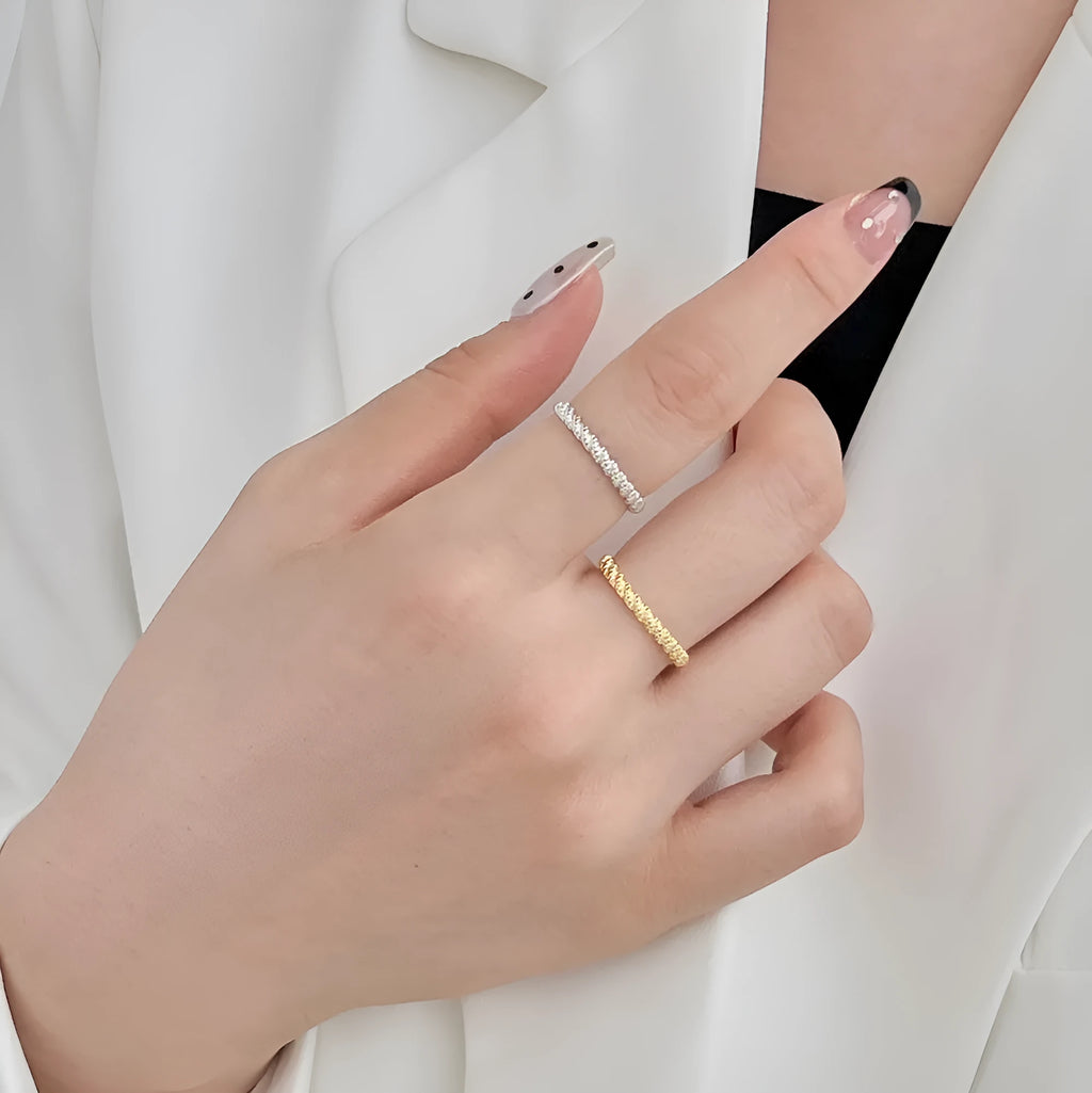S925 sterling silver ring with geometric twist design in white gold colour finish