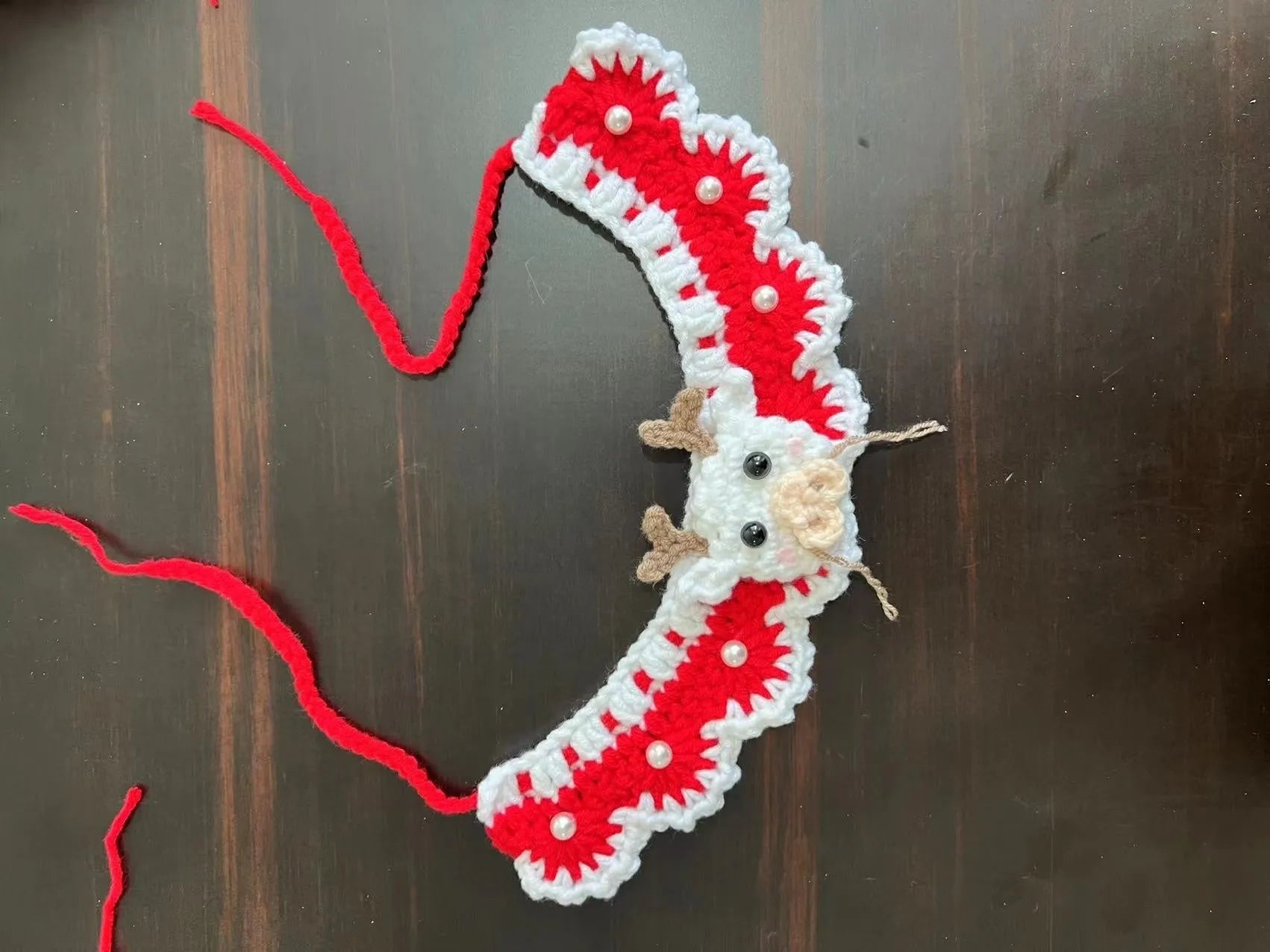 Knitted wool Christmas pet scarf with Santa Claus pattern for dogs and cats in holiday red and green colours