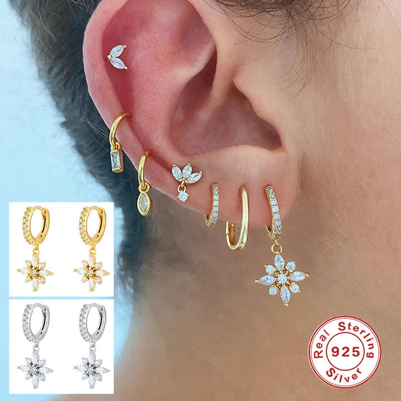 Sterling silver snowflake pendant earrings with gemstones in yellow or white gold plating.