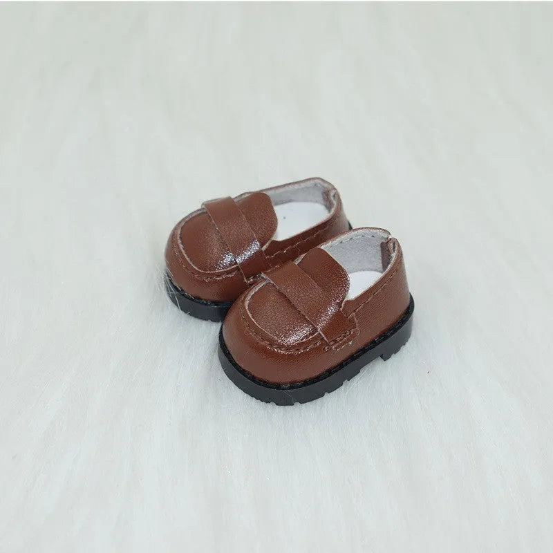 A pair of polyurethane doll shoe accessories for a 17cm figure, shown in a selected style and colour.