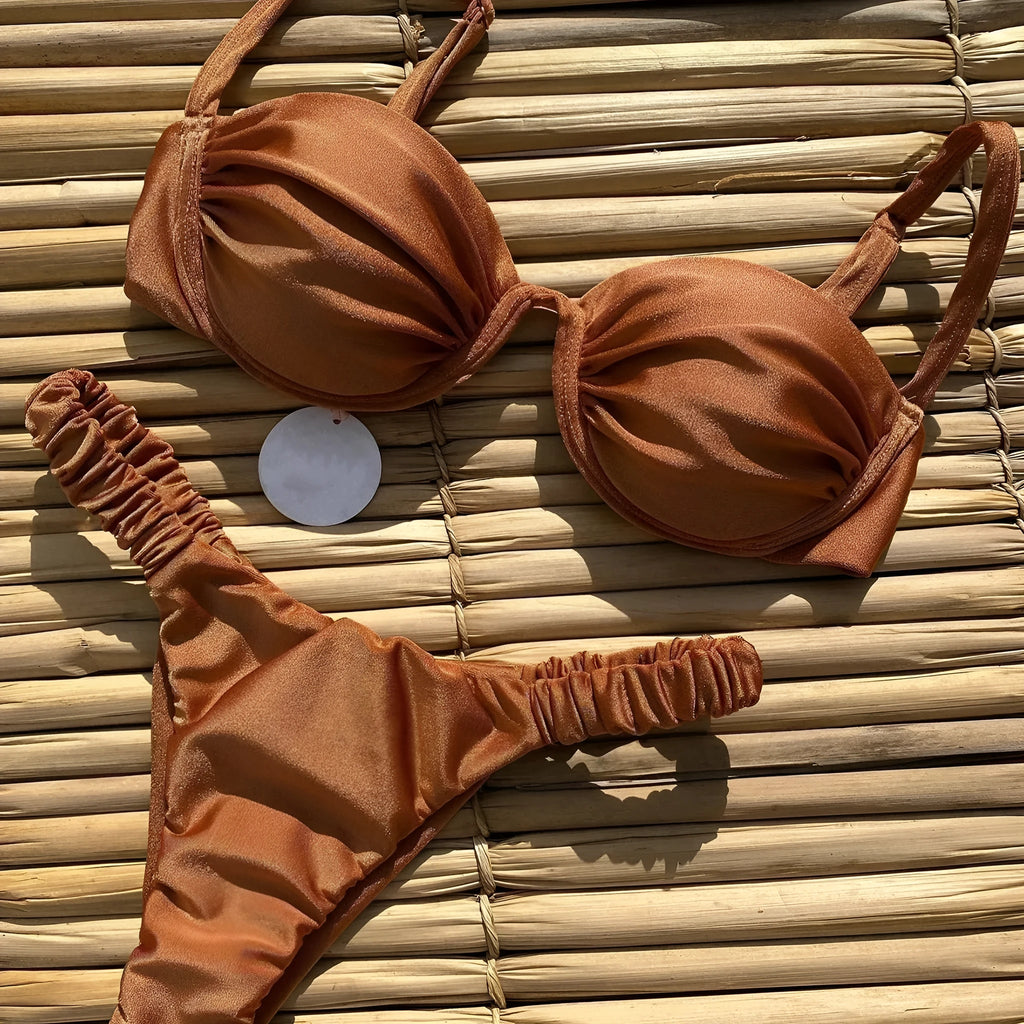 Women's black underwire bikini swimsuit with split brief style on a mannequin.