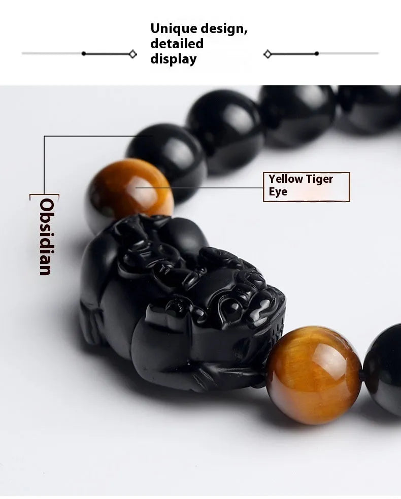 Black Mexico Gold Sheen Obsidian pi xiu bracelet with ethnic styling on wrist