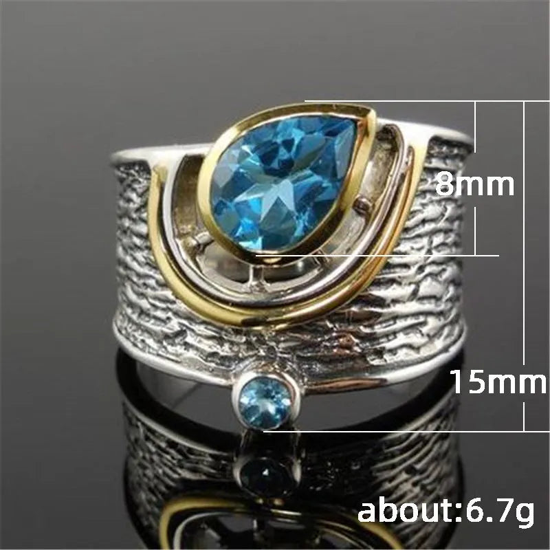 Chinese-style women's ring with blue rhinestones in drop shape design on alloy band