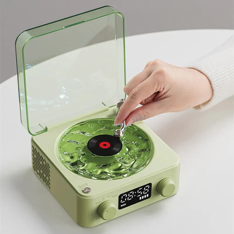 Retro Bluetooth speaker with rotating transparent turntable and RGB projection lighting effects