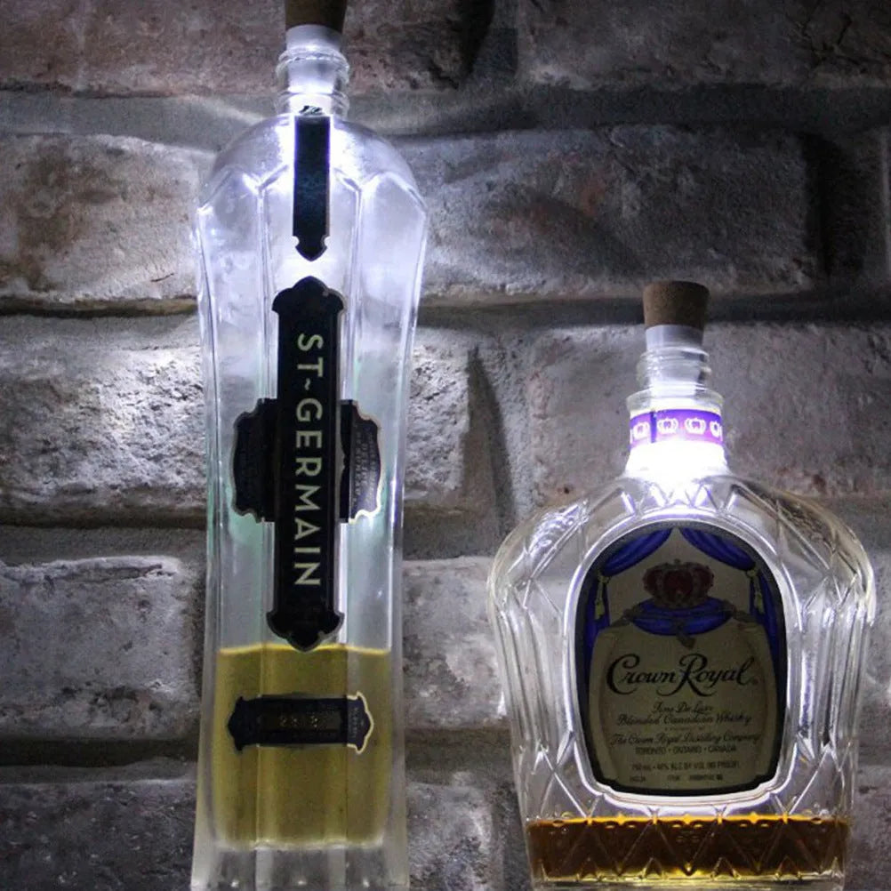 White plastic USB-rechargeable LED cork light for bottle decoration, showing compact size.