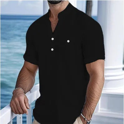 Man wearing a loose apricot-coloured linen stand collar T-shirt with short sleeves.