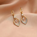 Teardrop-shaped water drop tassel earrings for women with a gold or silver electroplated finish.