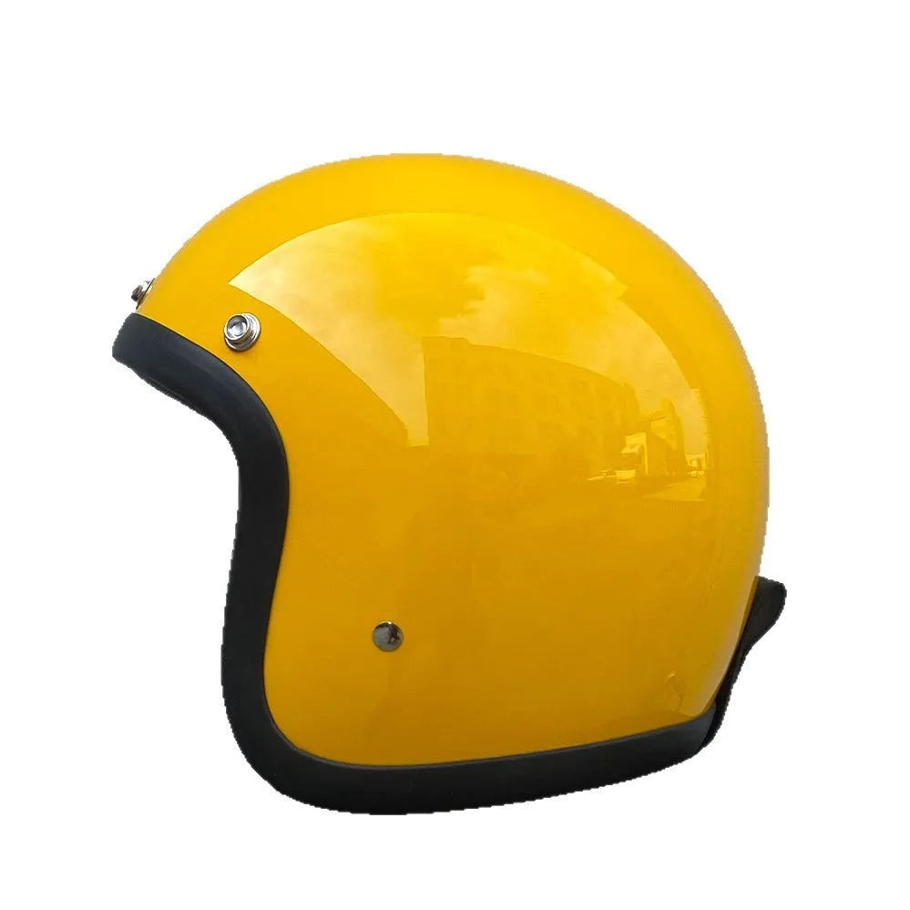 Retro-style open-face motorcycle helmet in cement grey with a textured finish and quick-release chin strap.