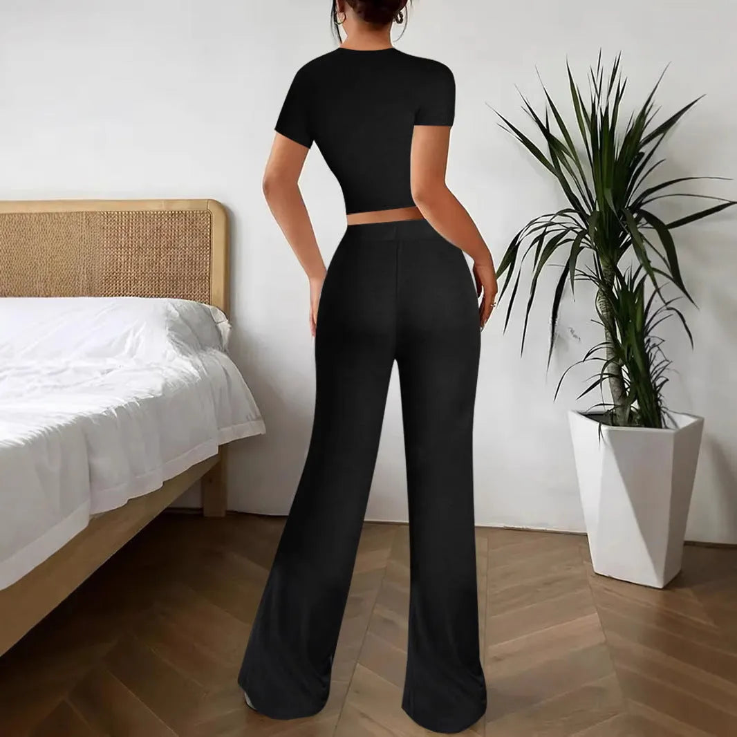 Black high waist trousers and regular sleeve T-shirt co-ordinated suit set.