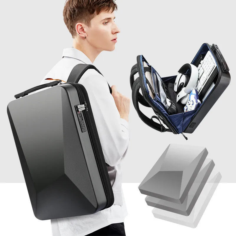 Titanium silver hard-shell men's backpack with combination lock on front, showing organised interior with laptop sleeve.