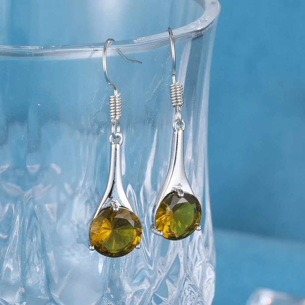 Olive green topaz colour earrings with water drop shape and retro style design