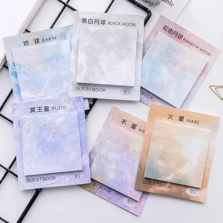 Square planet-themed sticky note pad showing 7.3cm size and oil painting designs of Moon and Earth.