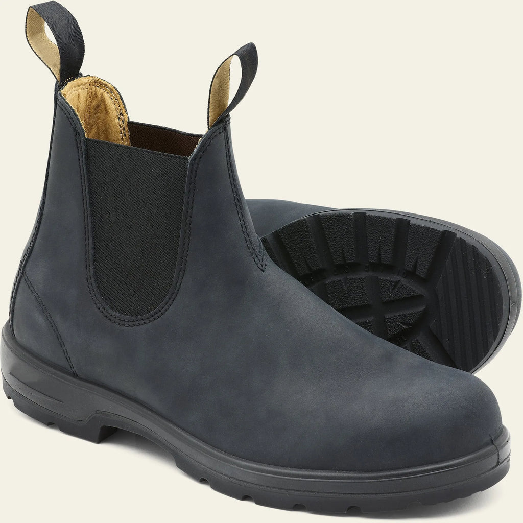 Vintage brown Chelsea boot with frosted PU upper, round toe, and mid-calf height on a wooden surface.