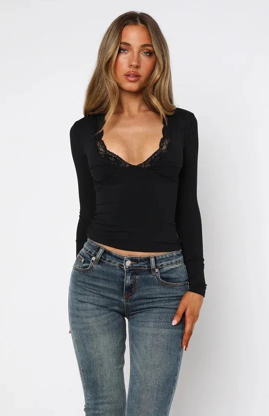 Women's slim fit pullover top with lace flower shoulder detailing in black or wine red