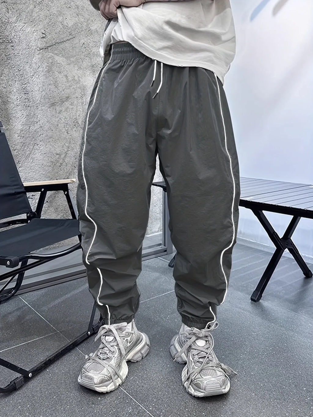 Men's loose fit bamboo fibre sports trousers in khaki with cropped length and elasticated waist.