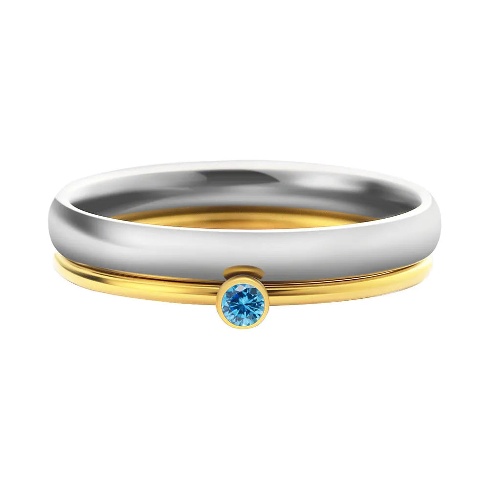 A geometric titanium steel ring with a December birthstone colour, gold electroplated handle, and engraved steel lettering.