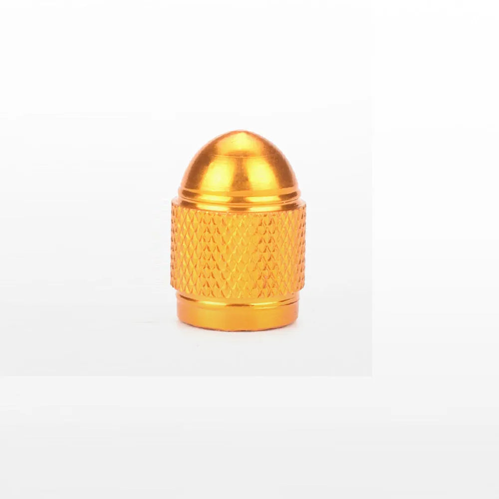 Aluminium alloy bicycle tyre valve cap in assorted colours on a black background.