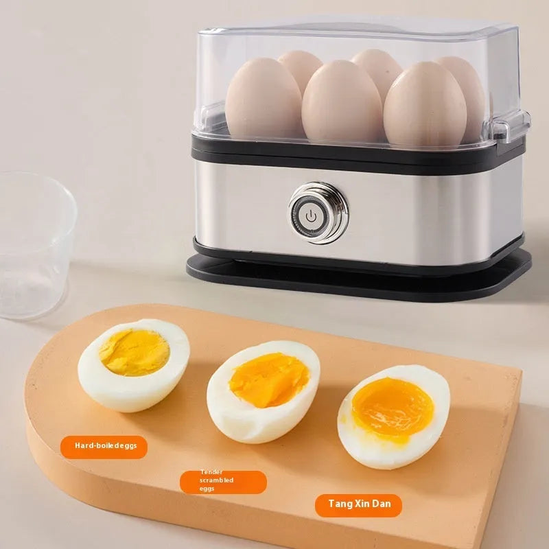 Black portable stainless steel egg boiler with a carrying belt for travel use.