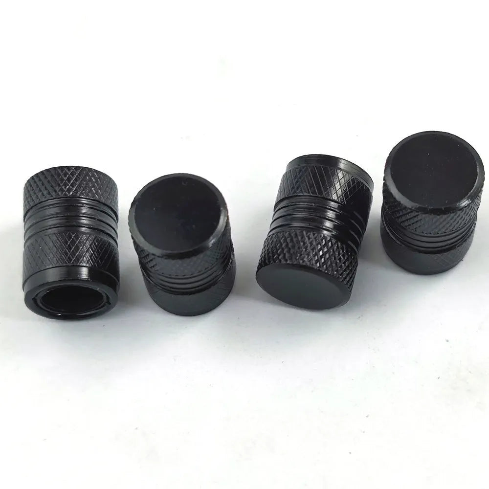 Aluminium car tyre valve dust cap in four colour options: black, blue, grey, and red.
