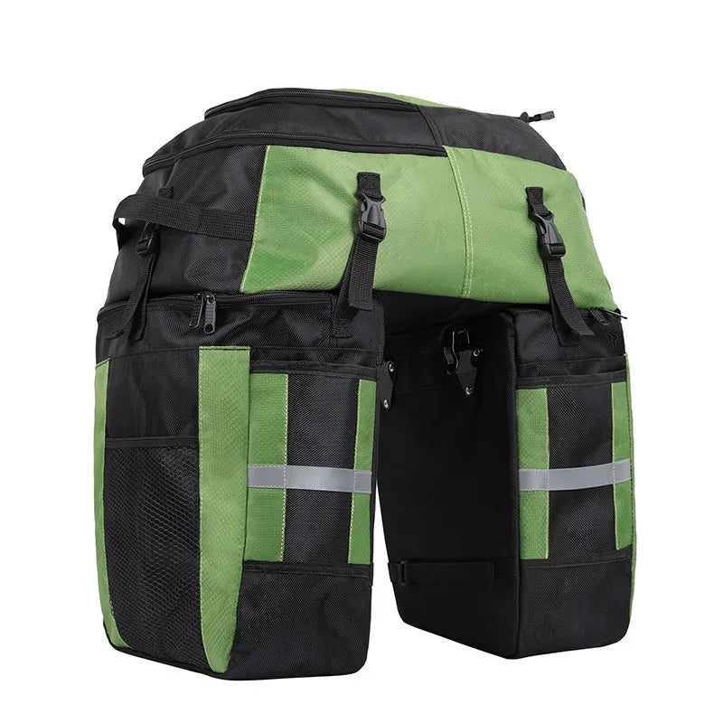 Green 70 litre bicycle rear storage frame bag mounted on a bike for touring.
