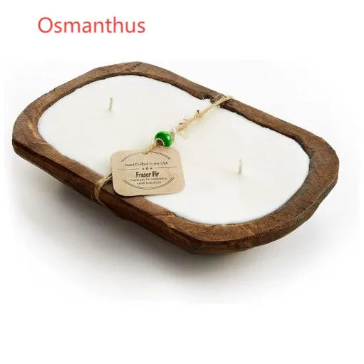 Lavender-scented soy wax candle in a wooden basin with a wooden wick