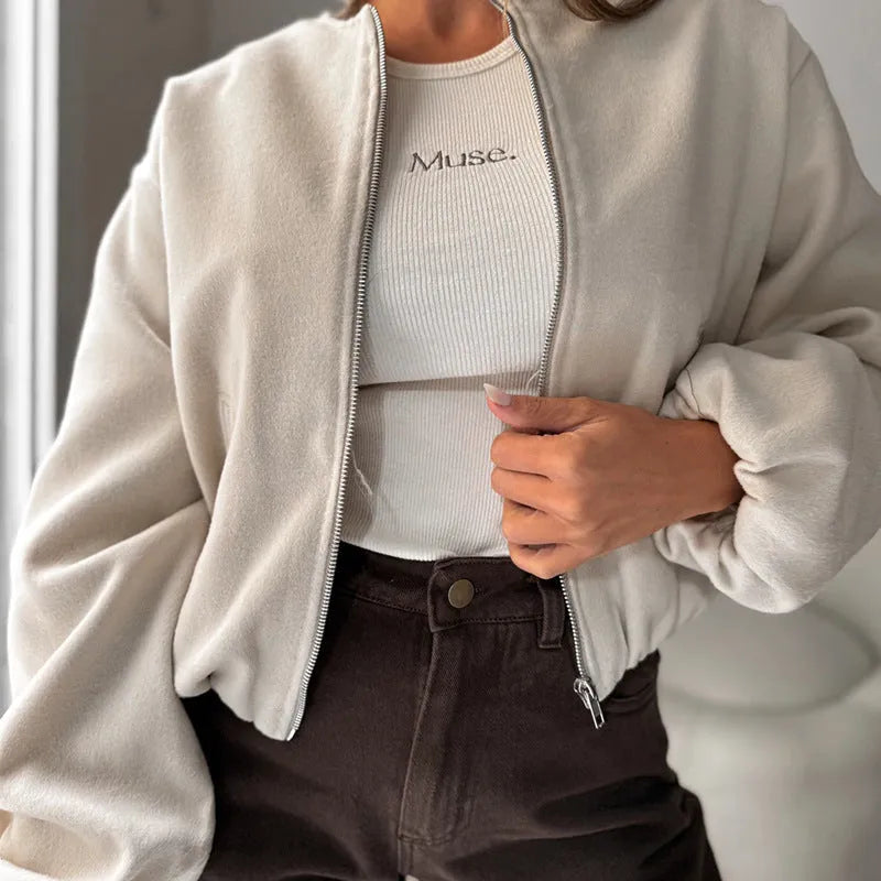 Women's off-shoulder short coat with lantern sleeves and round neck in brown.