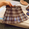 Girls' red and black plaid pleated A-line skirt made from cotton blend fabric.