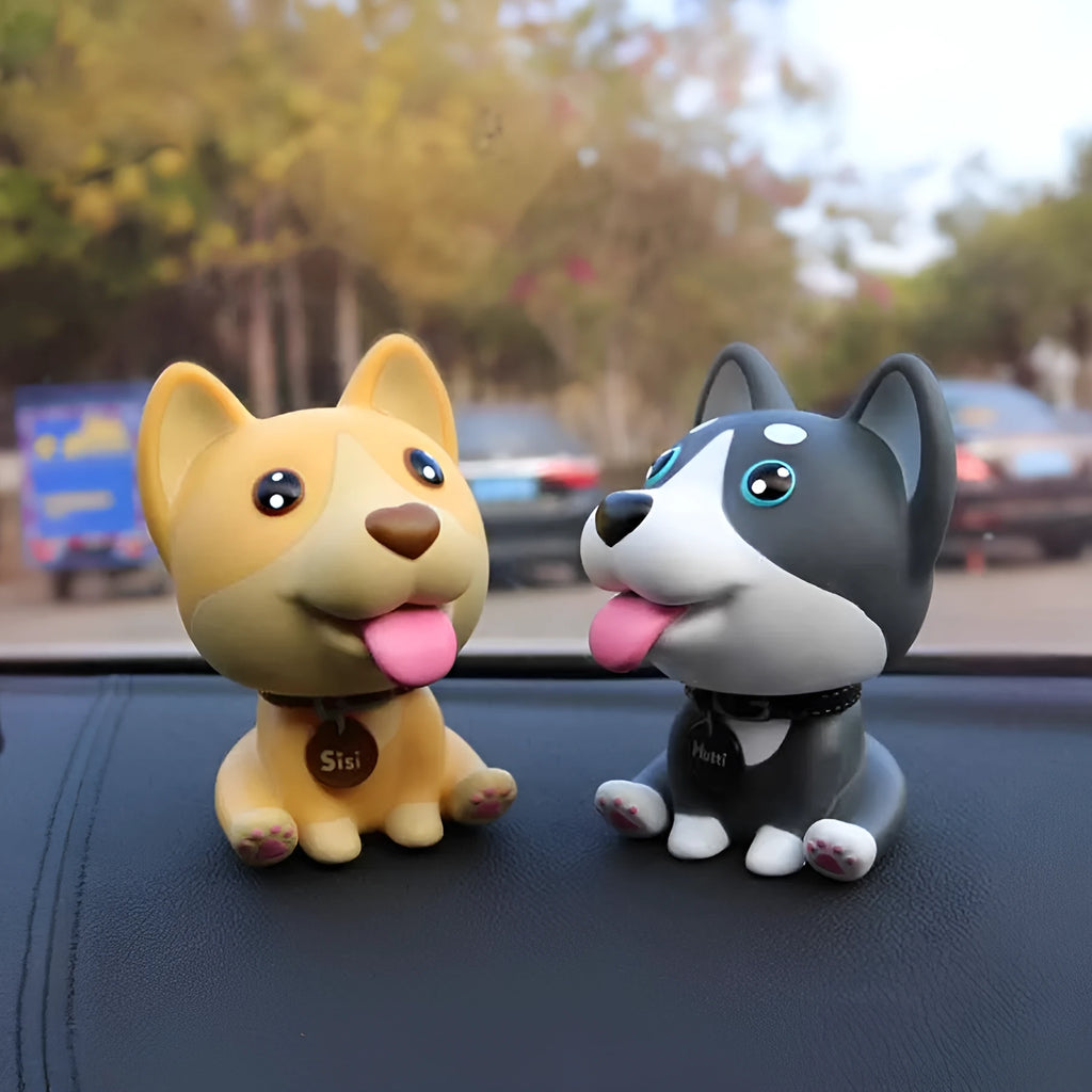 PVC nodding dog bobblehead in khaki, 9.3 cm tall, on a car dashboard