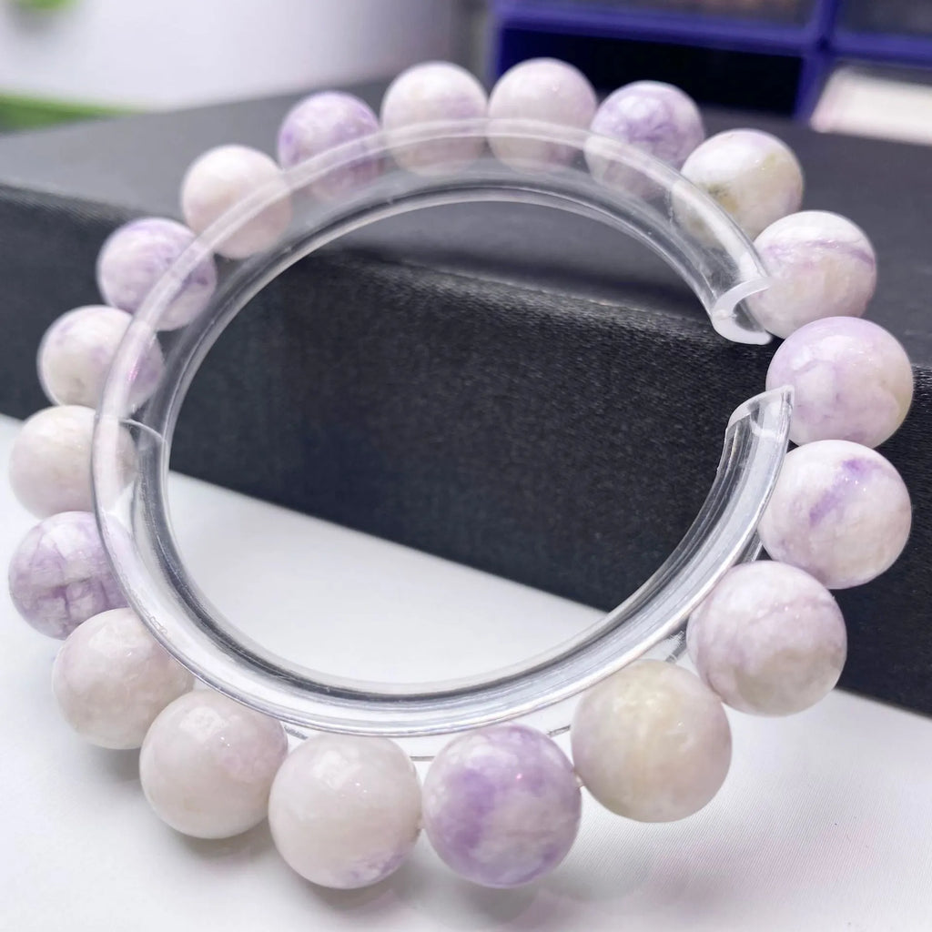 Women's natural purple turquoise bracelet showing different bead size options.