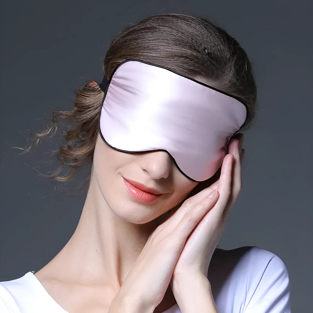 Double-sided mulberry silk sleep mask with embroidered print in various colours.