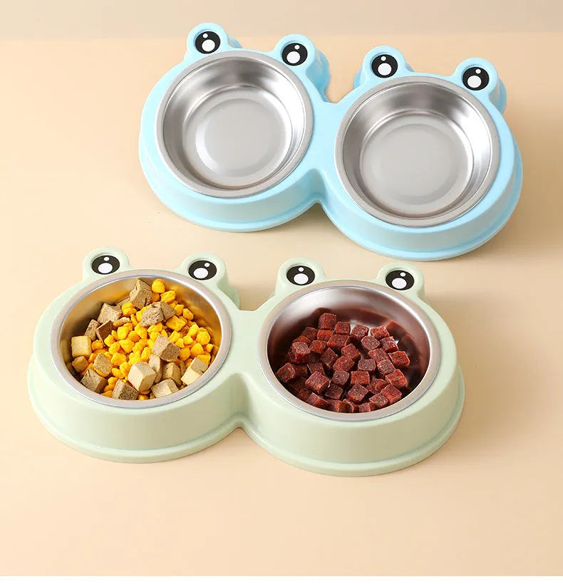 Stainless steel double compartment pet bowl for food and water on a silicone non-slip base.