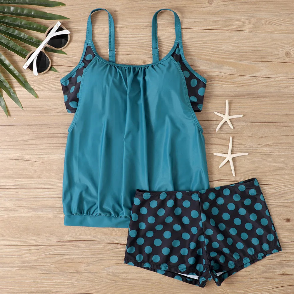 Women's black polka dot high-waist boxer swimsuit briefs on a mannequin.