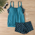 Women's black polka dot high-waist boxer swimsuit briefs on a mannequin.