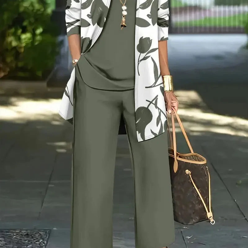 Women's blue printed casual three-piece suit featuring a long-sleeve coat, sleeveless vest, and trousers laid flat.