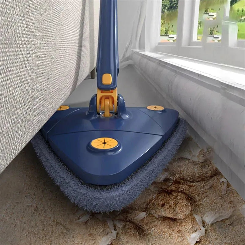 Blue extendable triangle cleaning mop with rotating head and stainless steel pole on a tiled floor.