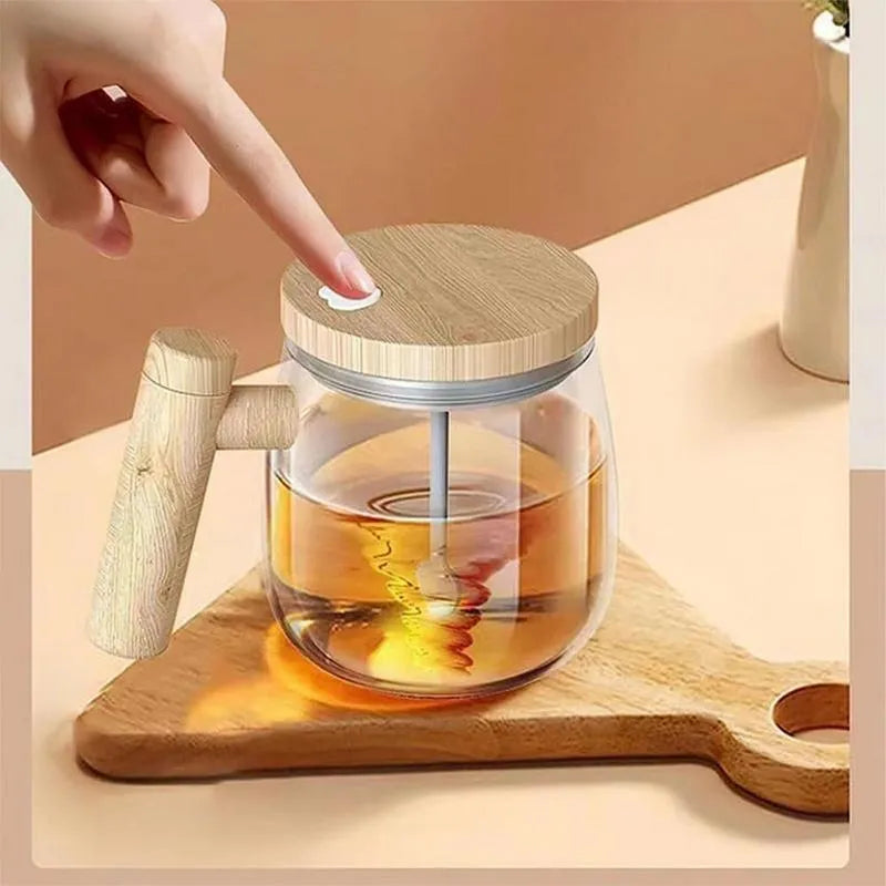 Clear borosilicate glass self-stirring coffee mug with button on base, 400ml capacity