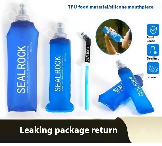 Flexible silicone drinking straw with black carabiner clip against outdoor background