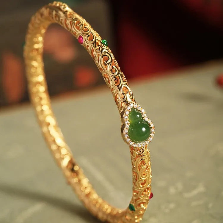 Gold-plated open back women's bracelet with traditional Chinese gourd charm on copper construction