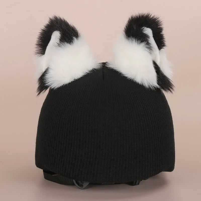 A soft plush cartoon character cover stretched over a medium-sized motorcycle helmet.