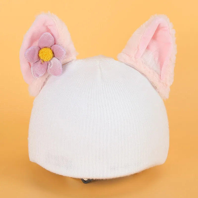 A soft plush cartoon character cover stretched over a medium-sized motorcycle helmet.
